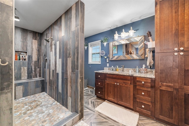 bathroom with walk in shower and vanity