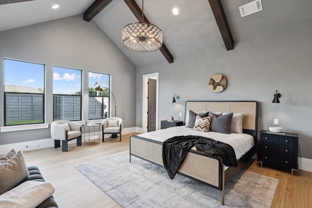 bedroom featuring visible vents, beam ceiling, recessed lighting, wood finished floors, and high vaulted ceiling