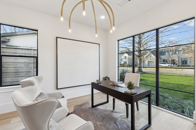 office area featuring recessed lighting, visible vents, and wood finished floors