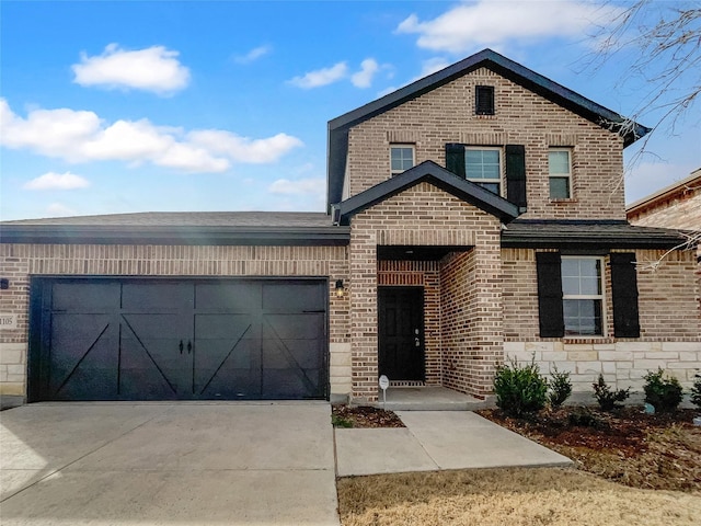 1105 Rountree Ct, Celina, TX 75009 - view of front of property featuring a garage, stone siding, brick siding, and driveway