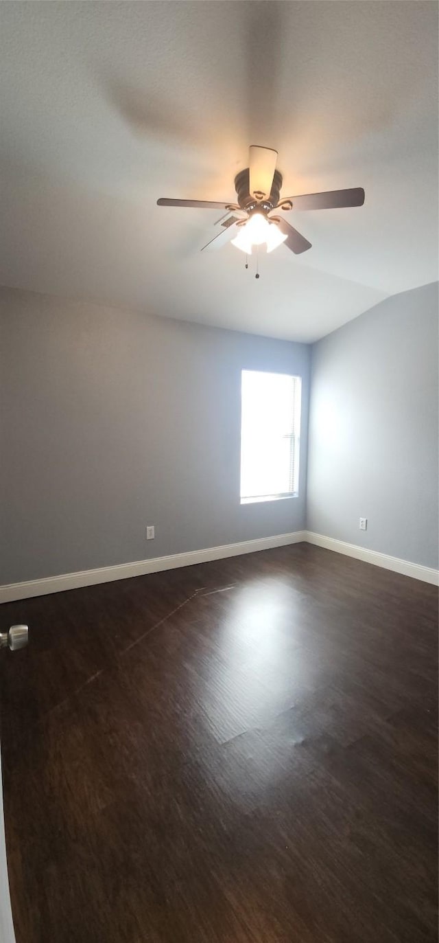 unfurnished room featuring baseboards and ceiling fan