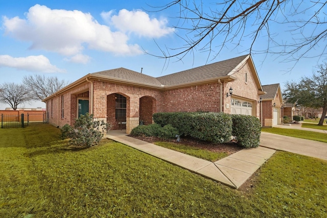 view of front of home featuring fence, a front lawn, concrete driveway, a garage, and brick siding