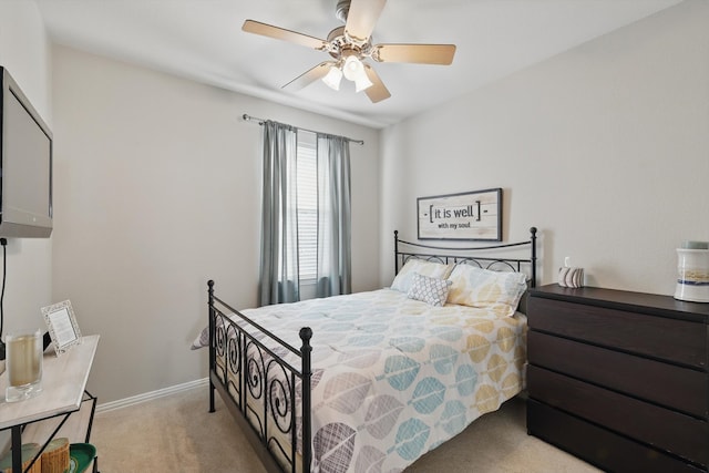 bedroom with baseboards, carpet, and a ceiling fan