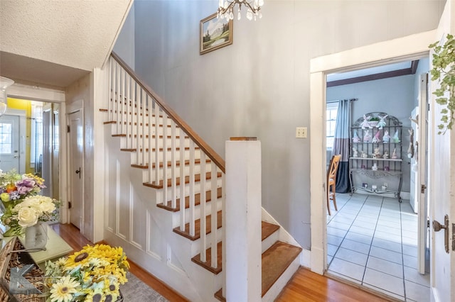 stairs featuring wood finished floors