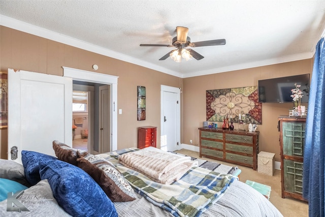 bedroom featuring light colored carpet, a textured ceiling, a ceiling fan, and ornamental molding