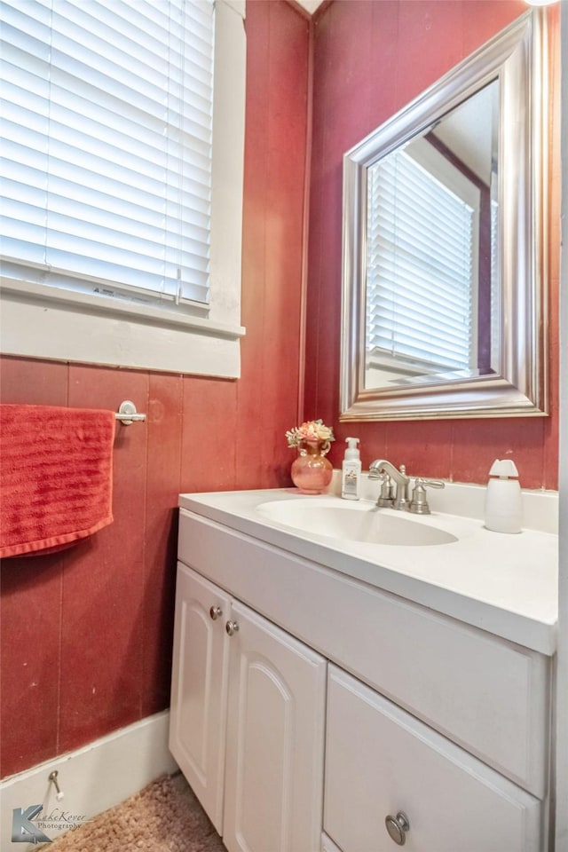 bathroom featuring a wealth of natural light and vanity