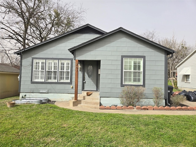 bungalow-style home featuring a front yard