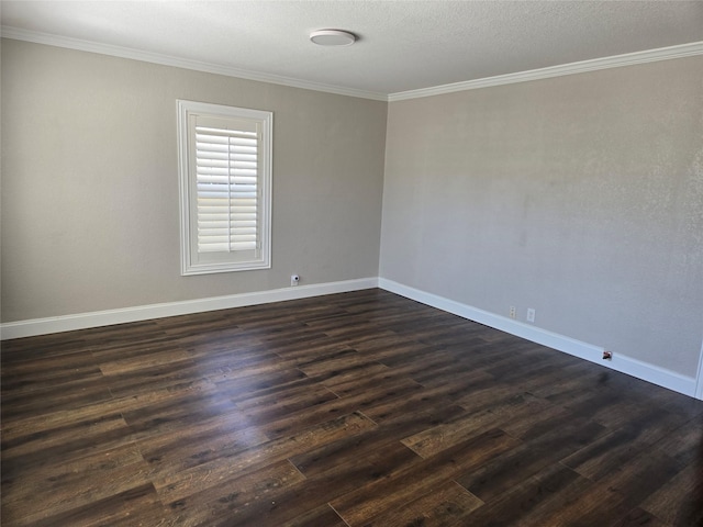 empty room with crown molding, baseboards, and dark wood-style flooring