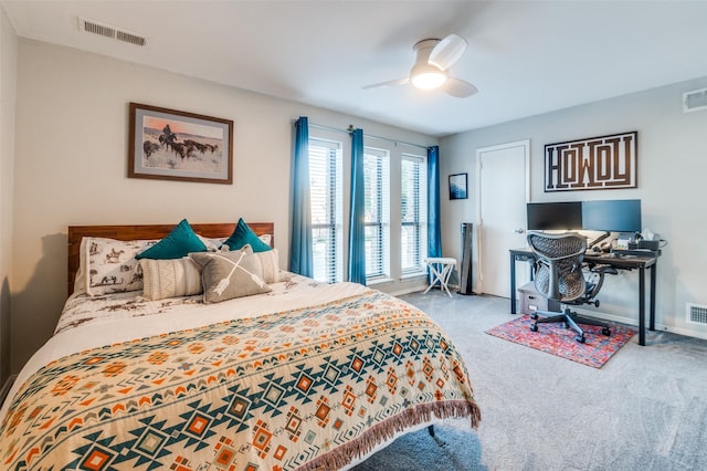 carpeted bedroom featuring baseboards, visible vents, and ceiling fan