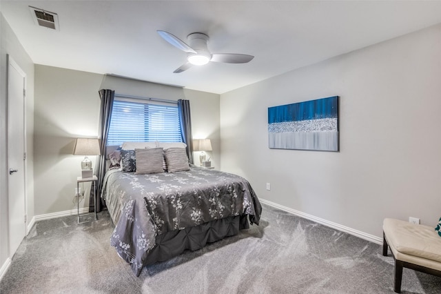 carpeted bedroom featuring visible vents, baseboards, and ceiling fan