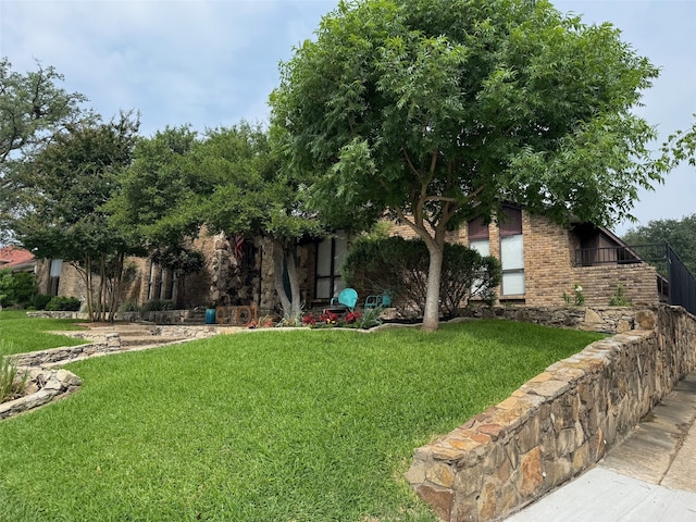 9701 Vista Oaks Dr, Dallas, TX 75243 - view of front of house with a front yard and brick siding