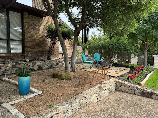 9701 Vista Oaks Dr, Dallas, TX 75243 - view of yard featuring a patio, fence, and an outdoor fire pit