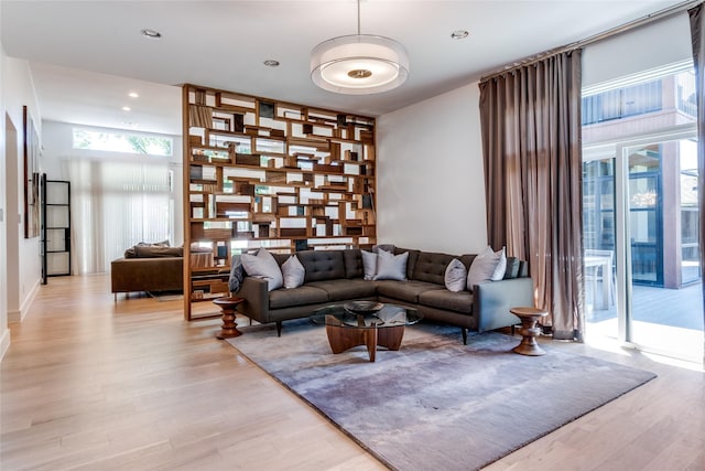 living room with recessed lighting and light wood-type flooring