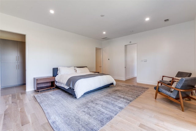 bedroom featuring visible vents, recessed lighting, and light wood-type flooring