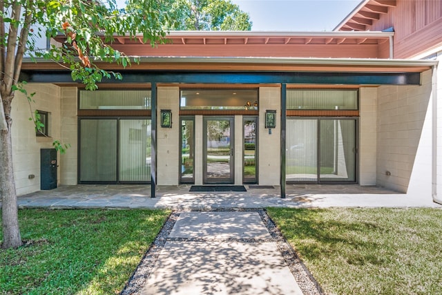 view of exterior entry with concrete block siding