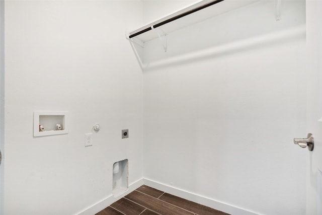 laundry room featuring electric dryer hookup, wood finish floors, gas dryer hookup, hookup for a washing machine, and laundry area