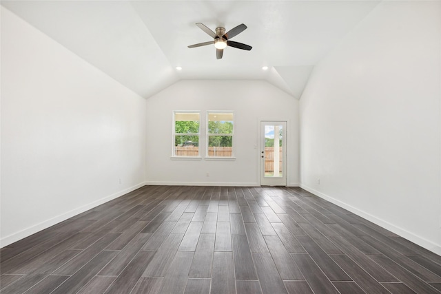 spare room featuring baseboards, lofted ceiling, ceiling fan, and wood tiled floor