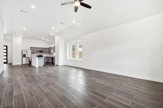 unfurnished living room featuring a ceiling fan, visible vents, wood tiled floor, recessed lighting, and vaulted ceiling