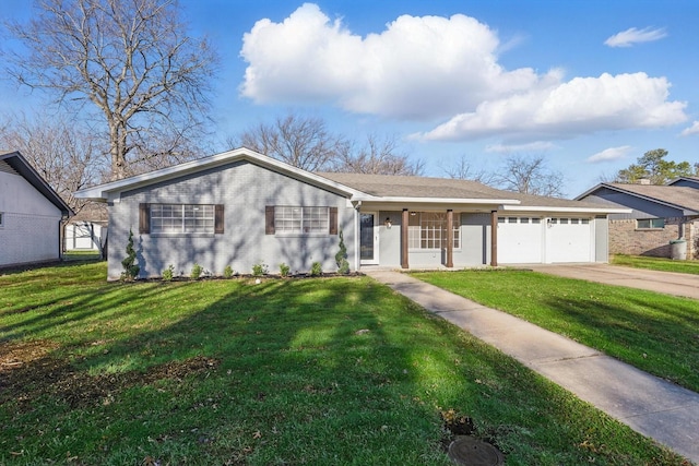 view of front of house featuring brick siding, driveway, a front lawn, and a garage