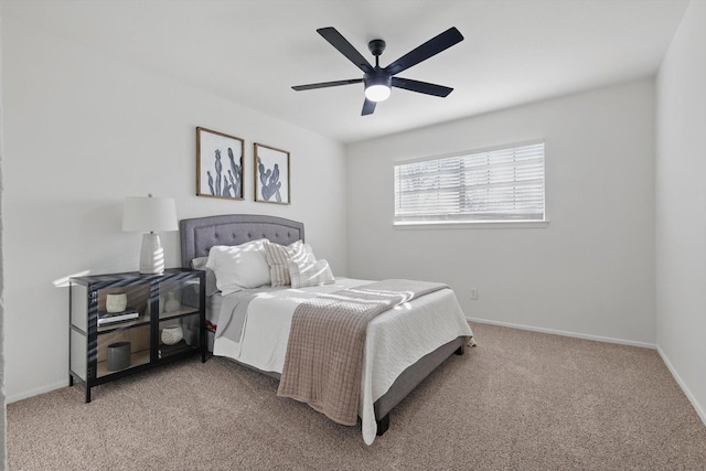 carpeted bedroom featuring a ceiling fan and baseboards