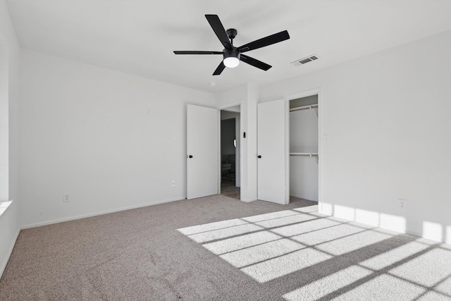 unfurnished bedroom with baseboards, visible vents, ceiling fan, a closet, and light colored carpet