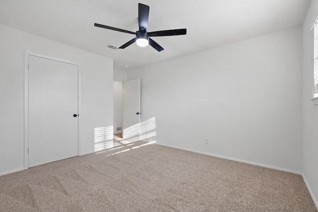 unfurnished bedroom with visible vents, baseboards, carpet, and ceiling fan