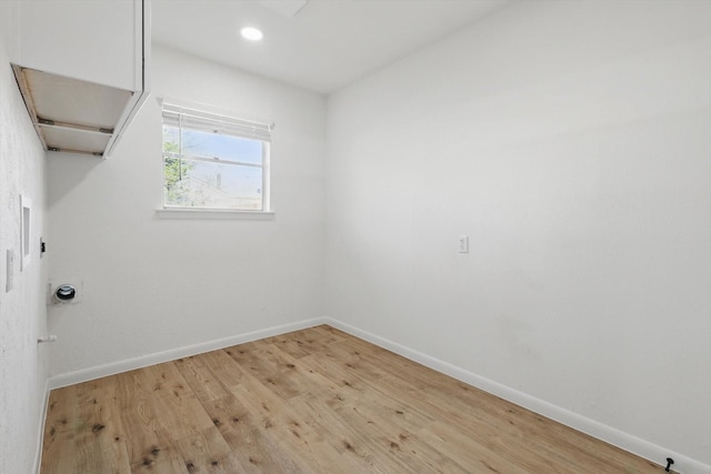 interior space with recessed lighting, light wood-style floors, and baseboards