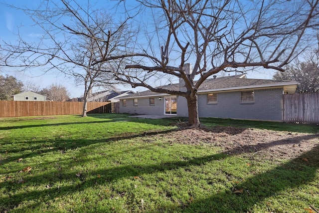 view of yard featuring a patio and fence