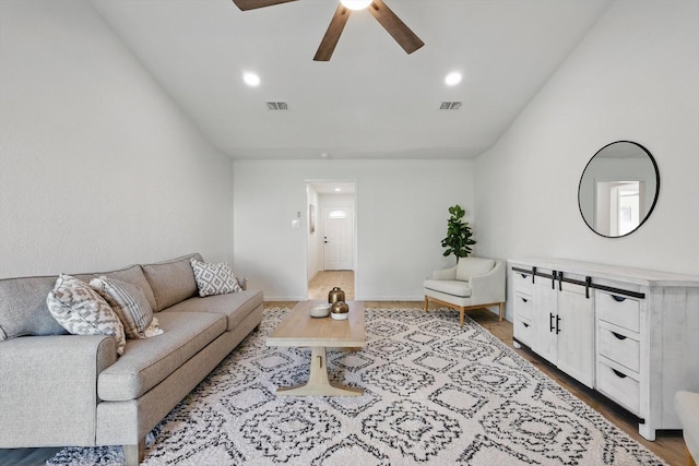 living room with visible vents, recessed lighting, a ceiling fan, and wood finished floors