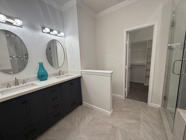 bathroom with ornamental molding, a stall shower, and a sink