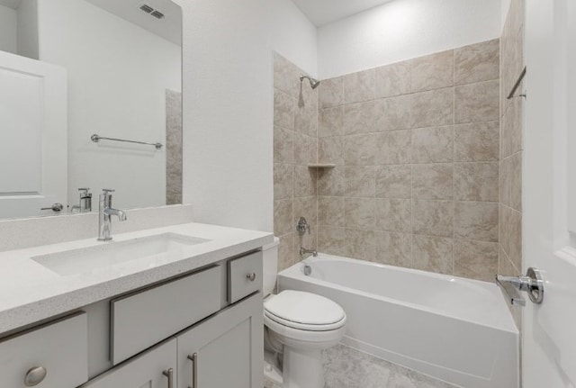 bathroom featuring visible vents, toilet, vanity, and  shower combination