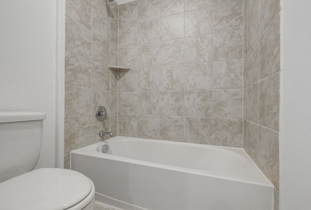 bathroom with shower / washtub combination and toilet