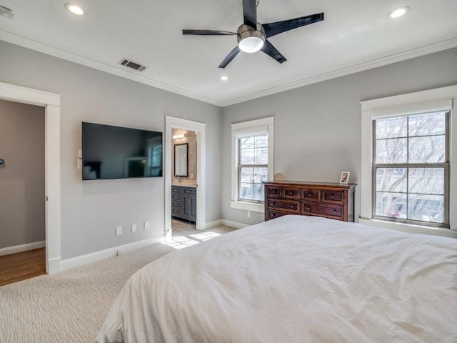 bedroom featuring baseboards, visible vents, recessed lighting, crown molding, and light colored carpet