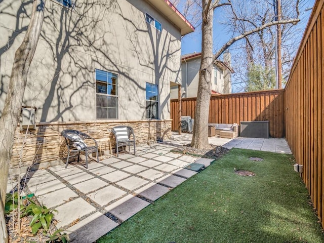 view of patio / terrace featuring fence