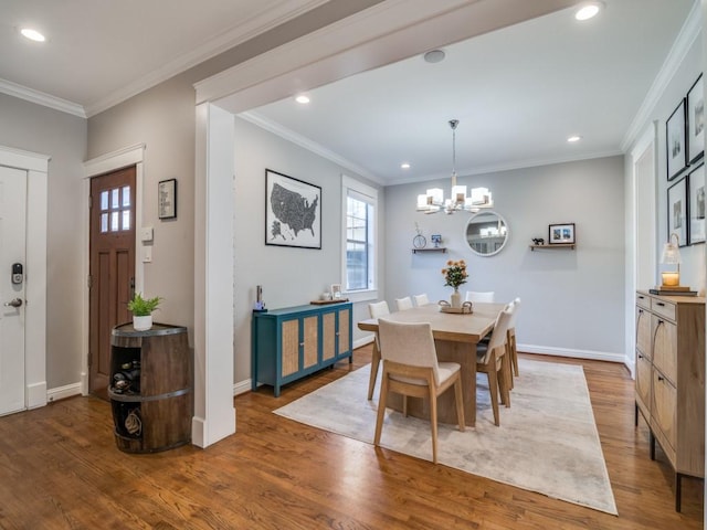 dining area featuring recessed lighting, ornamental molding, baseboards, and wood finished floors