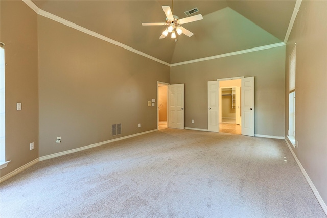 unfurnished bedroom with visible vents, light colored carpet, crown molding, and baseboards