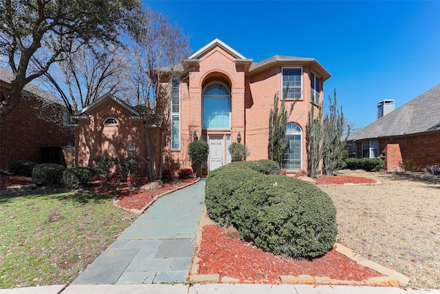 traditional home with brick siding