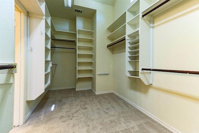 spacious closet featuring carpet flooring and visible vents