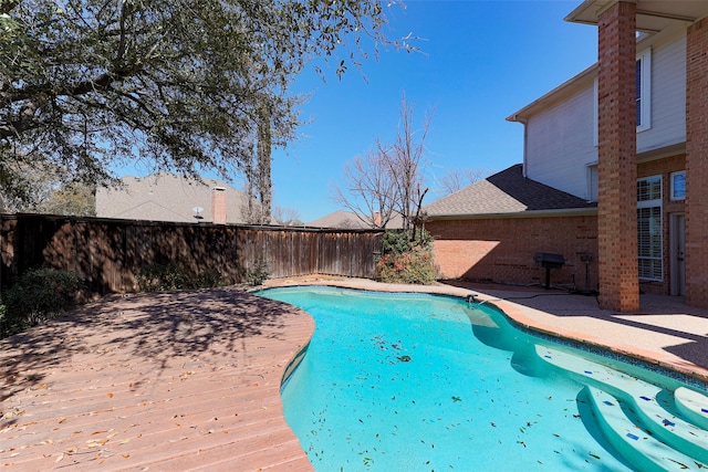 view of pool with a patio area, a fenced in pool, and a fenced backyard