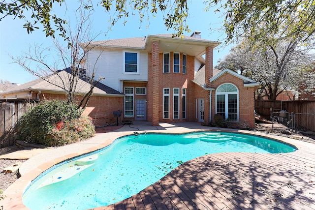 view of swimming pool with a patio, a fenced backyard, and a fenced in pool