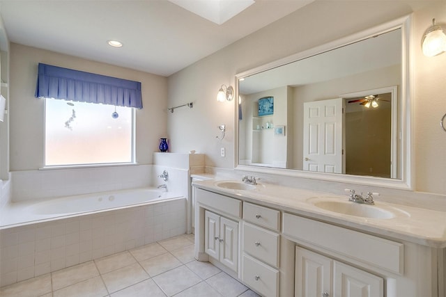 full bathroom with a garden tub, double vanity, tile patterned floors, and a sink