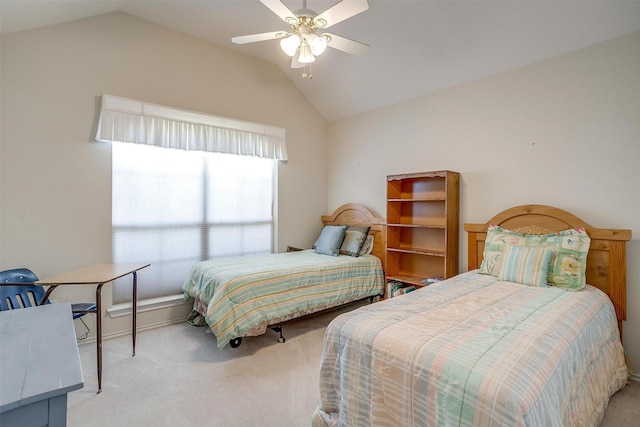 bedroom featuring ceiling fan, vaulted ceiling, and light carpet