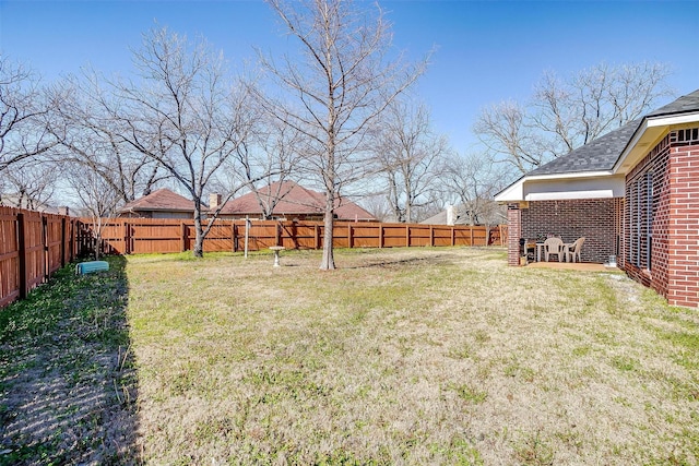 view of yard featuring a fenced backyard