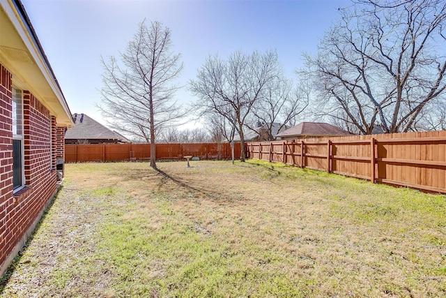 view of yard featuring a fenced backyard