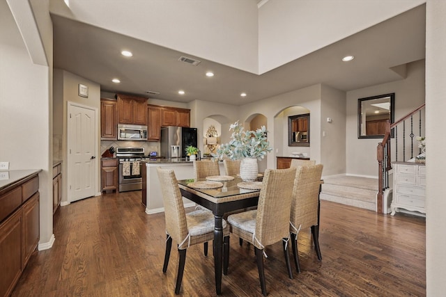 dining room featuring visible vents, recessed lighting, dark wood-type flooring, and baseboards