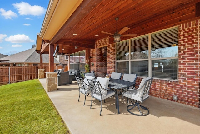 view of patio / terrace featuring outdoor dining area, ceiling fan, and fence