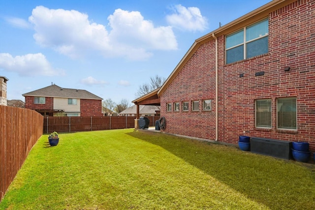 view of yard with a fenced backyard