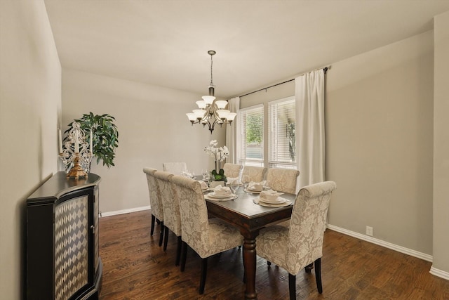 dining space featuring baseboards, an inviting chandelier, and dark wood finished floors