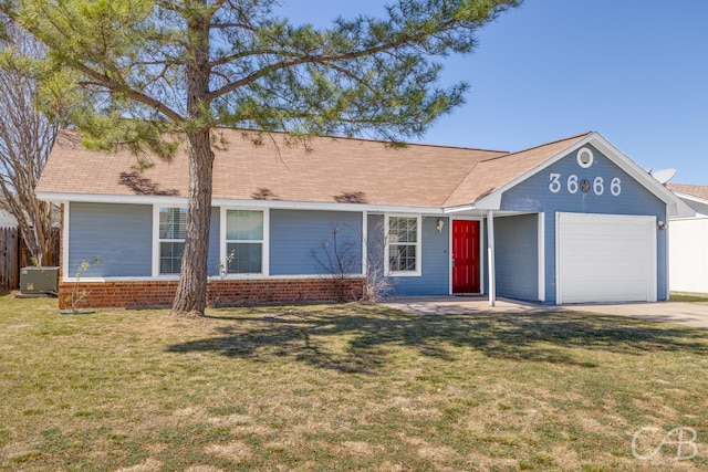 ranch-style house with a front lawn, fence, concrete driveway, an attached garage, and brick siding