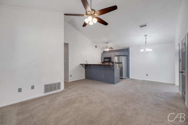 unfurnished living room featuring lofted ceiling, light colored carpet, and visible vents